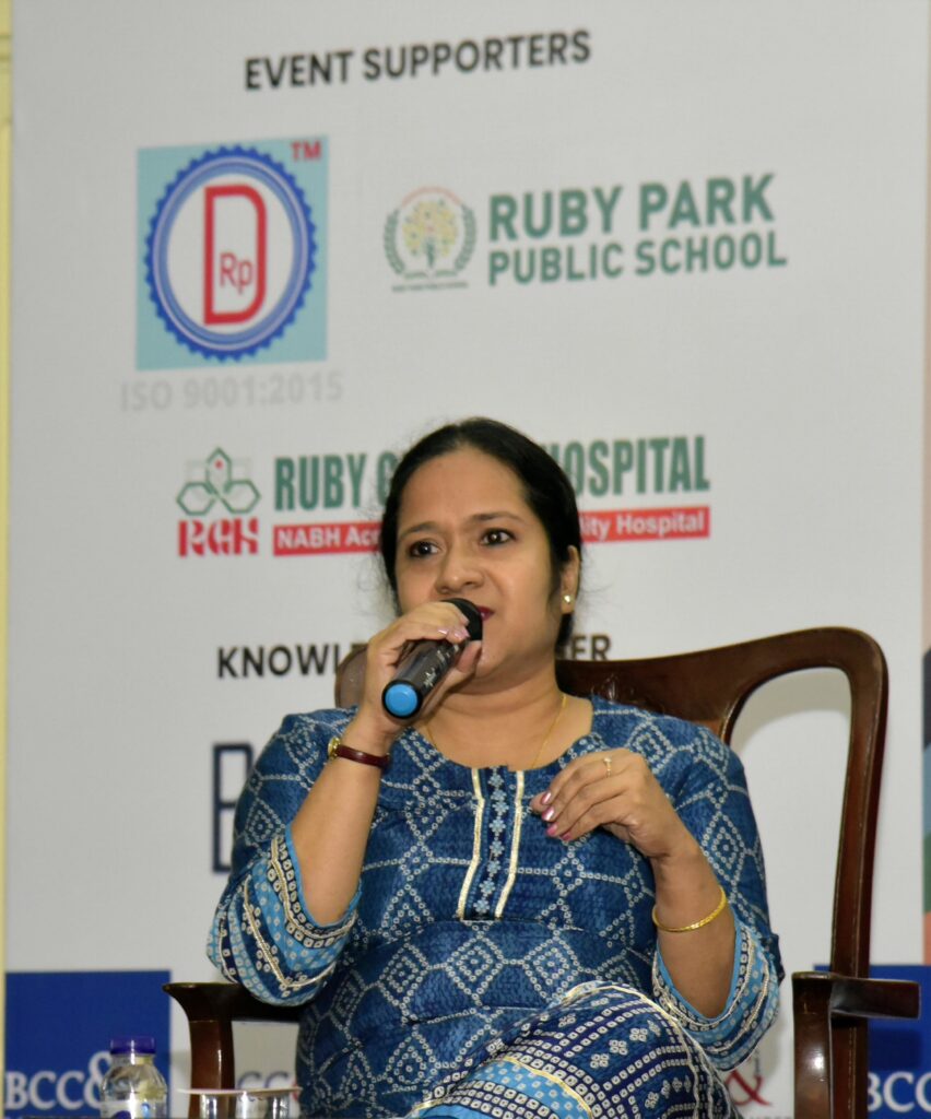 Sreedevi in blue dress as speaker in LGBTQ+ seminar